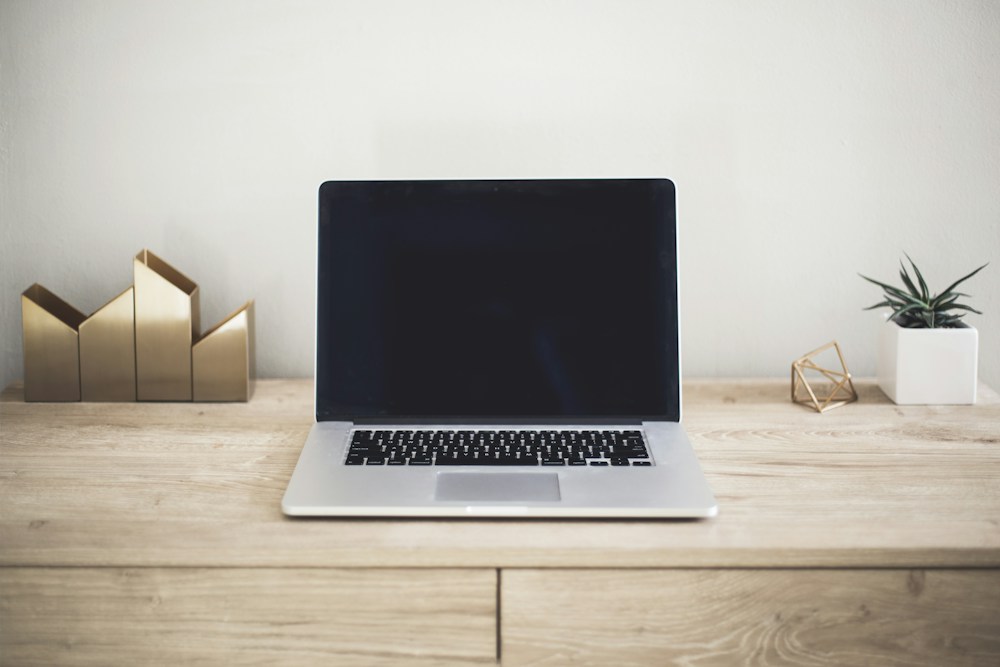 Laptop workspace for auditing search visibility, content structure, and conversion journeys
