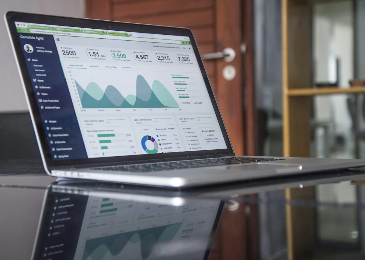 Marketing analytics and campaign performance data displayed on a laptop